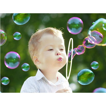 Bubble gun liquid refill bottle with a clear label showing liquid inside