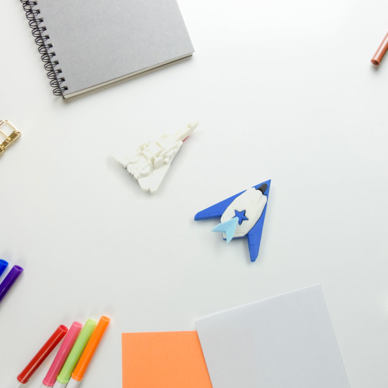 Colorful gun and plane-shaped erasers for children