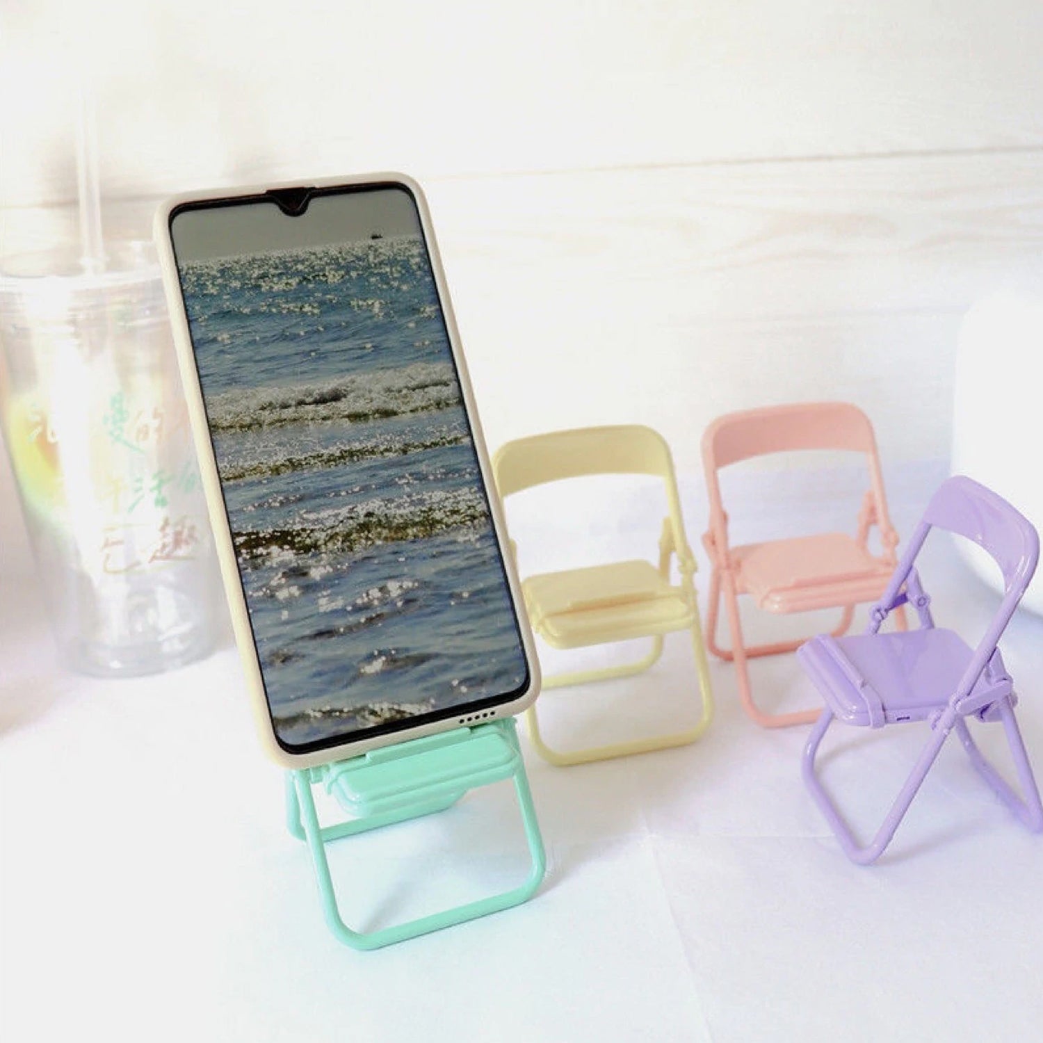 Phone holder stand in chair shape